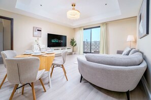 Enjoy a meal at the dining table for four, relax on the sofa, and take in the city view from the large window.