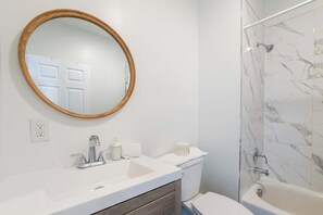 Shower, hair dryer, towels, shampoo
