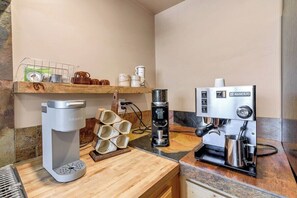 A coffee station with a Keurig coffee maker, a Rancilio espresso machine, and a coffee grinder. - Dorado Golf Villa,Pet Friendly (Tucson)