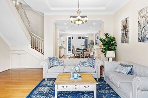Beautifully appointed living room with stylish sofas, a large rug, and classic decor for a comfortable retreat. - East Perth Luxury Waterfront Retreat (East Perth)