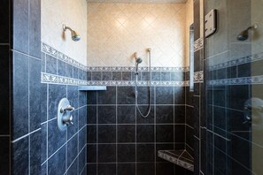 Shower, hair dryer, towels, shampoo