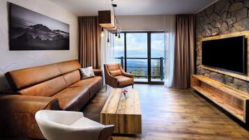 Deluxe Studio Suite, Valley View | Living area | Flat-screen TV, heated floors