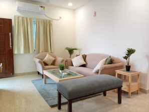 Two Bedroom Apartment | Living area | 44-inch LED TV with cable channels - Enkay Service Apartment (Hyderabad)
