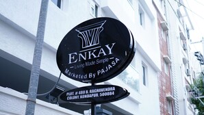 A sign for ENKAY, a living simple brand marketed by PAJASA, located at Plot # 480 B, Rachavendra Colony, Kondapur, 500084. - Enkay Service Apartment (Hyderabad)