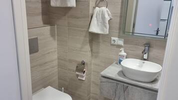Shower, towels, soap, shampoo