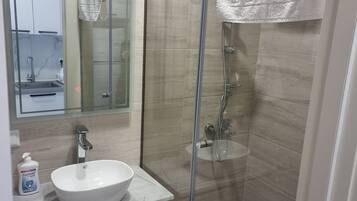 Shower, towels, soap, shampoo
