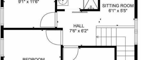 A floor plan with two bedrooms, a sitting room, a bathroom, a hall, and a W.C. The dimensions are provided for each room.