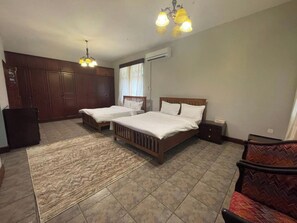 Family Room, Balcony, Garden View | Individually decorated, individually furnished, desk, laptop workspace - Olivia Guesthouse (Mwanza)