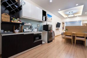 Enjoy cooking in this well-equipped kitchen with a central island, microwave, and oven, perfect for meal prep and dining.