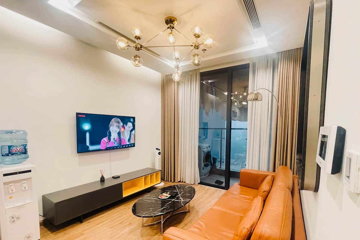 Deluxe Apartment | Living area | 45-inch LCD TV with satellite channels