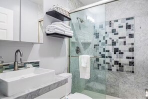 Shower, hair dryer, towels, soap