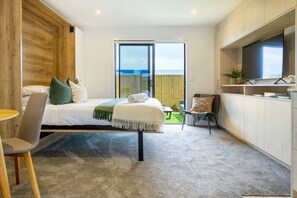 1 bedroom, desk, iron/ironing board, travel crib