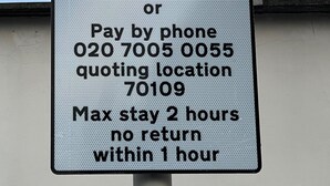 A parking sign with operating hours and payment instructions. - Stratford- (London)