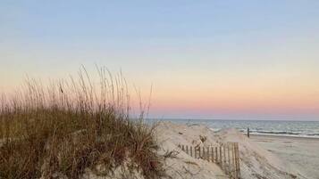 On the beach, sun loungers, beach towels