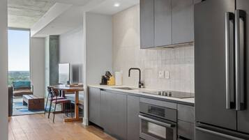 Condo, 1 King Bed with Sofa bed, Balcony, City View | Private kitchen | Full-sized fridge, oven, stovetop, dishwasher
