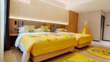 A hotel room with two beds, a yellow theme, and a teepee decoration.