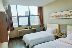 A hotel room with two beds, a desk, a window with a city view, and a painting on the wall. - HanTing Premium Hotel (Hangzhou Linping Intime City Subway Station) (Hangzhou)