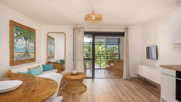 Deluxe Duplex, Sea View | Living area | 32-inch flat-screen TV with satellite channels