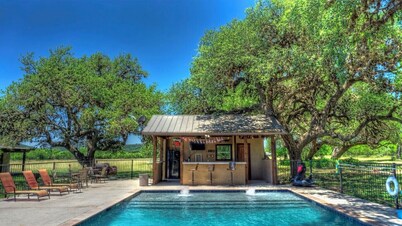  6-bedroom Lodge on 12 acres in Concan, Texas.  Swimming pool & hot tub.