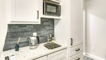 Fridge, microwave, cookware/dishes/utensils, paper towels