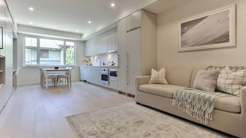 Basic Studio | Living area | 50-inch Smart TV with cable channels, Netflix, pay movies