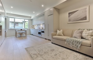 Basic Studio | Living area | 50-inch Smart TV with cable channels, Netflix, pay films