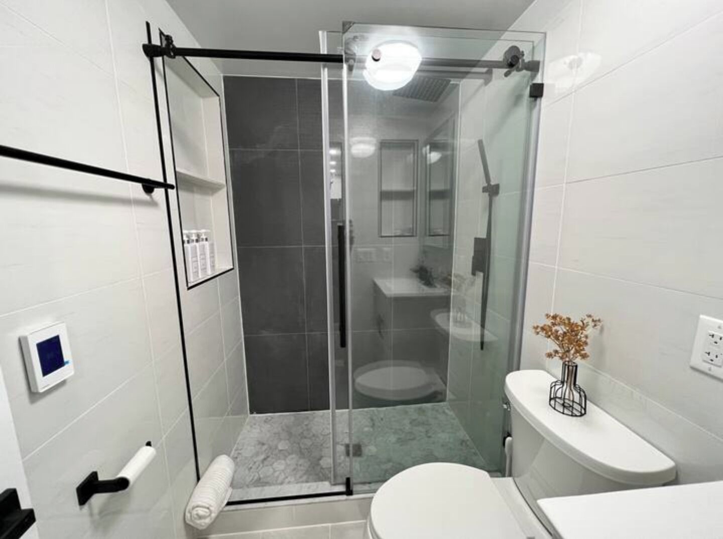 Shower, hair dryer, towels, soap