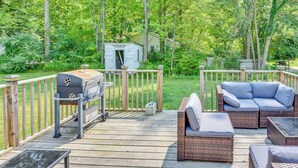 A wooden deck with outdoor furniture, a grill, and a small shed. - 2 Mi to Lake Michigan: Pet-Friendly Sawyer Apt (Sawyer)