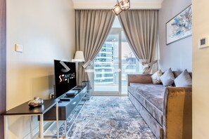 TV - Staycae Holiday Homes 1 Bedroom Family Apartment - Reva (Dubai)