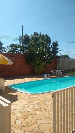 Outdoor pool, pool umbrellas, pool loungers