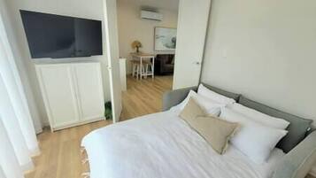 2 dormitorios, tabla de planchar con plancha, wifi gratis y ropa de cama