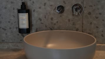 Shower, hair dryer, slippers, towels