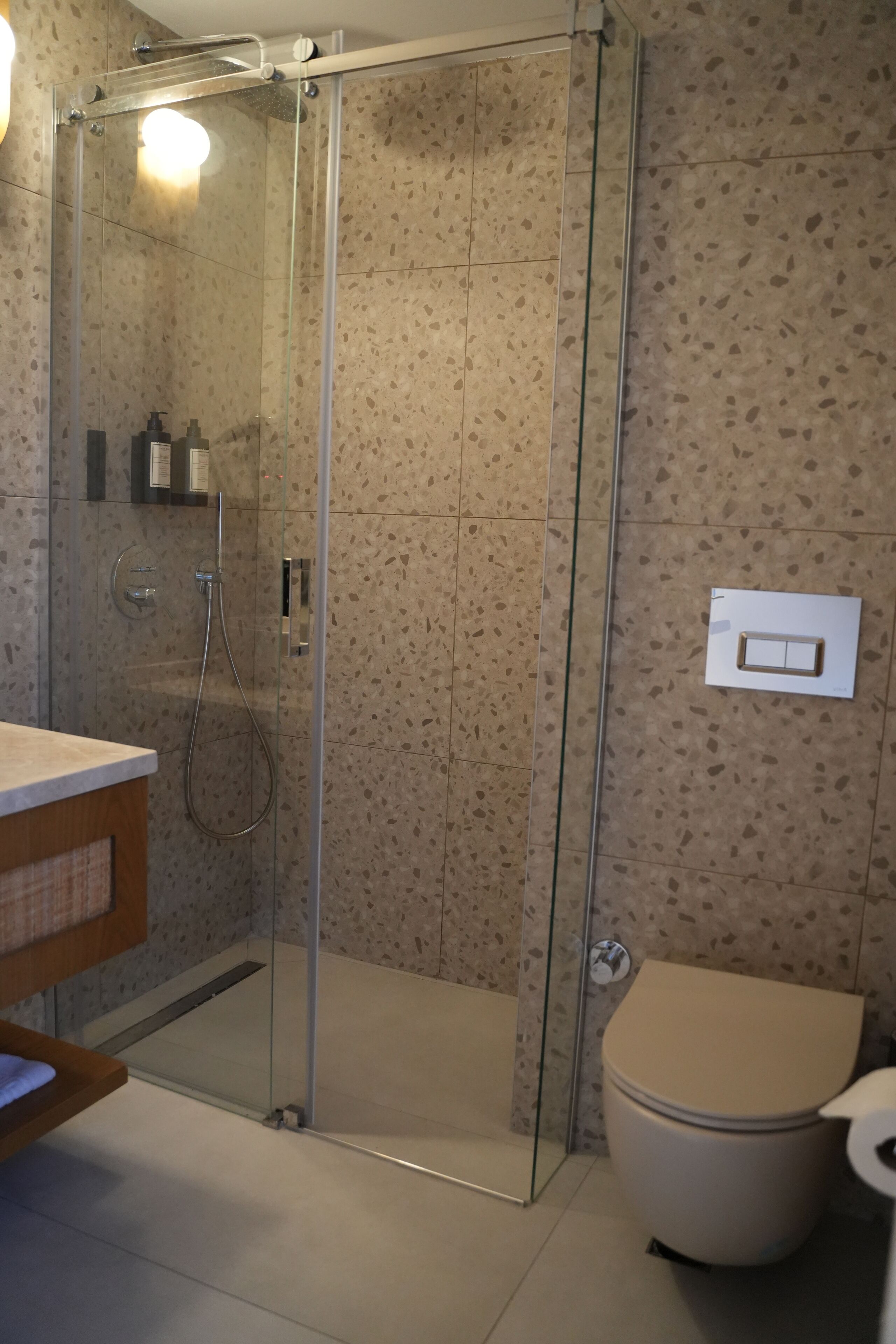 Shower, hair dryer, slippers, towels