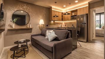 Deluxe Apartment, Balcony, City View | Living area | TV
