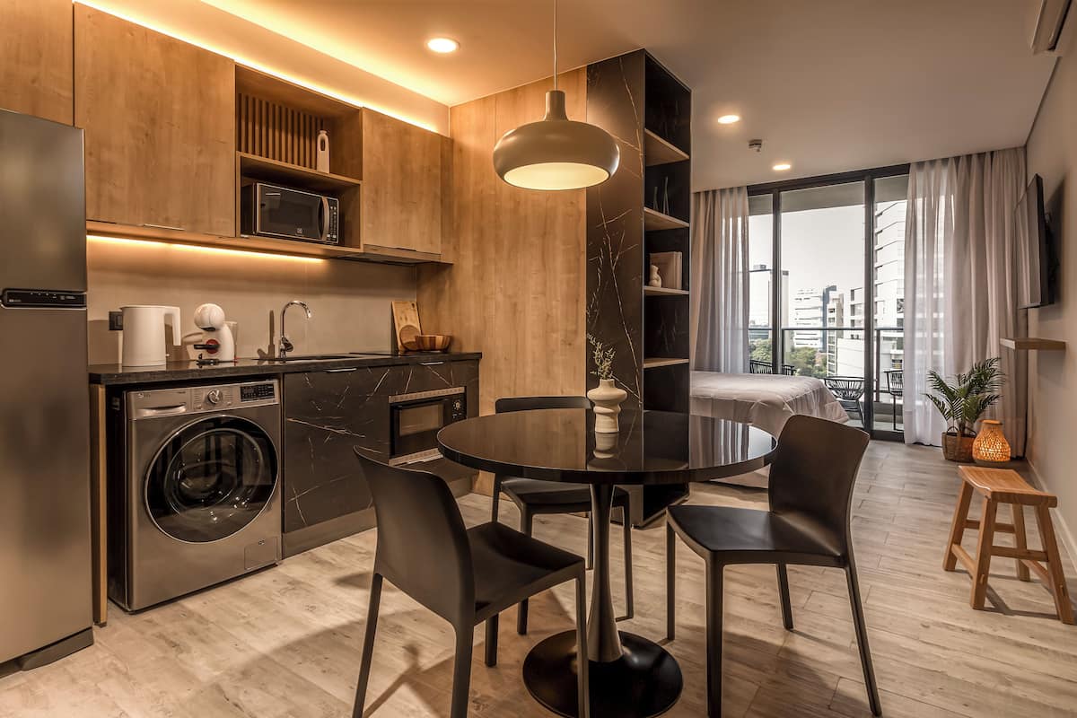 Basic Studio, Balcony, City View | Living area | TV