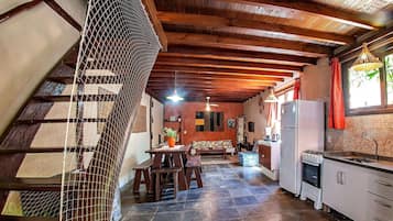 Chalet | Private kitchen | Fridge, cookware/dishes/utensils, dining tables