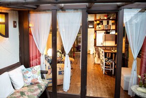 Loft Premium com Varanda - Pousada Rosa da Praia | Vardagsrum | 32-tums smart-tv med digitalkanaler, Netflix och streamingtjänster