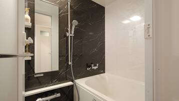 Hair dryer, slippers, towels, shampoo