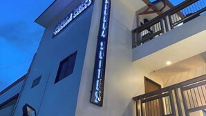 A hotel with a prominent sign reading "HOTELS" and a balcony with wooden railings. - Aurora Suites Pasay near Airport (Pasay)