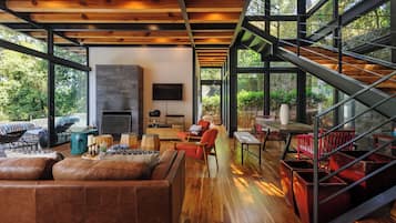 Deluxe House | Living area | 60-inch flat-screen TV with digital channels, fireplace