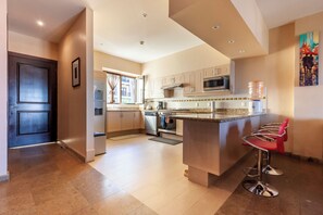 Panoramic Apartment, City View | Private kitchen | Full-size fridge, microwave, oven, stovetop - Caracol 37 Luxury Condo (San Miguel de Allende)