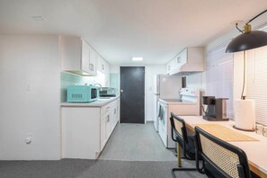 Fridge, coffee/tea maker, cookware/dishes/utensils