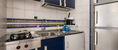 Fridge, microwave, stovetop, cookware/dishes/utensils