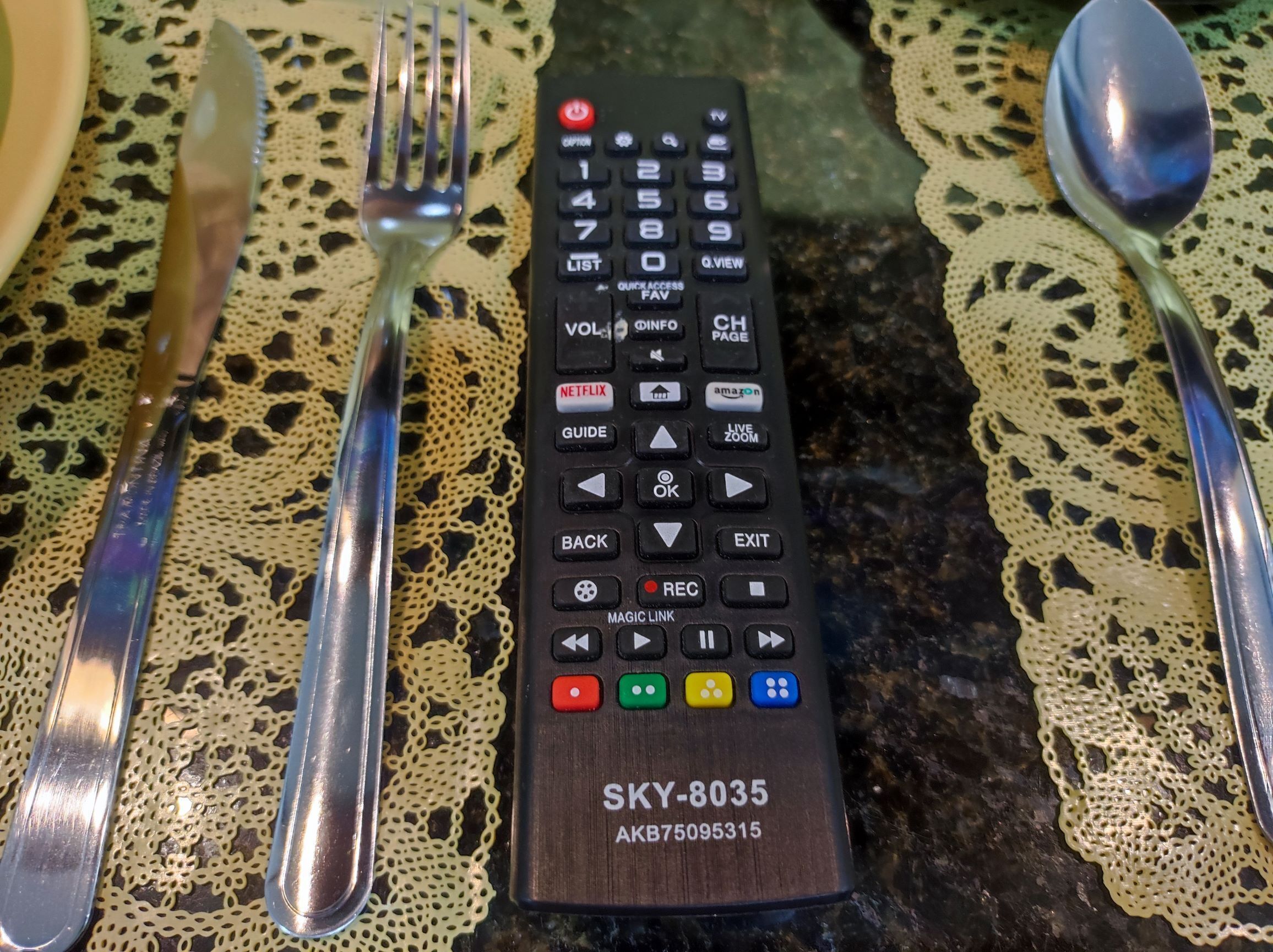 A remote control with a wooden base labeled SKY-8035.