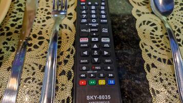 A remote control with a wooden base labeled SKY-8035.