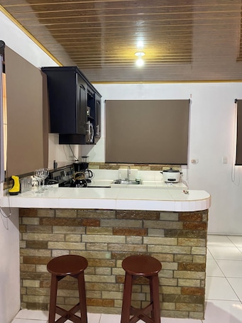 Private kitchen. Caribe Rosa Charming 2-bedroom apartment in wonderful Limon with AC, WiFi