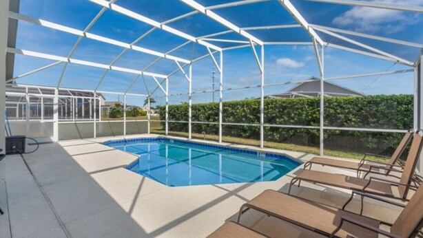 A covered swimming pool with a clear view of the surrounding area.
