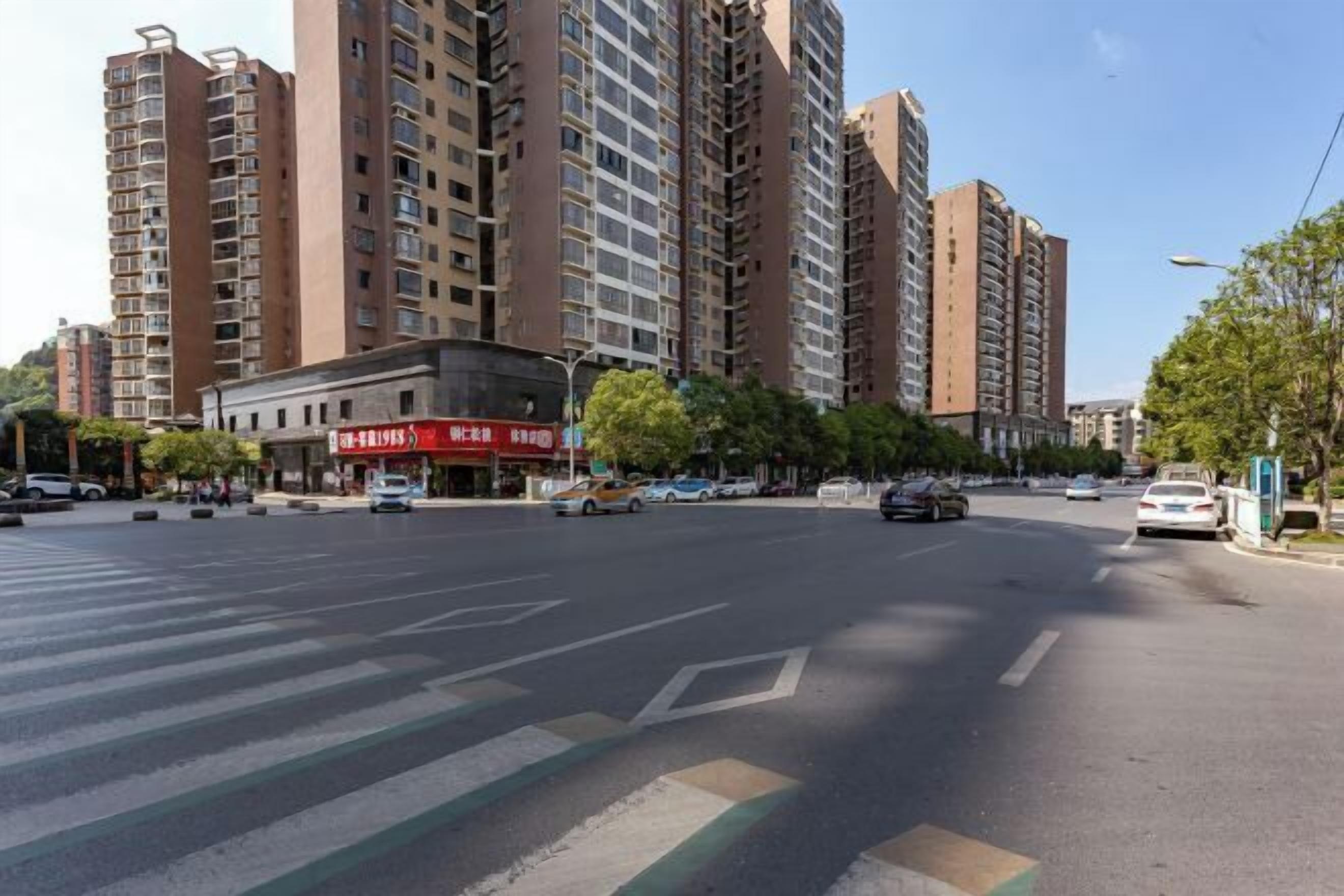 A multi-story residential building with a commercial establishment on the ground floor.
