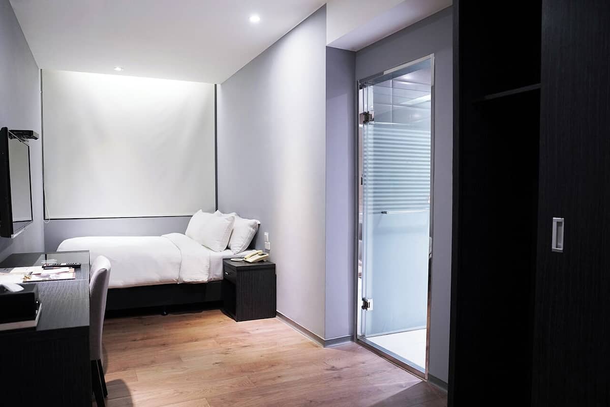 Economy Double Room | Down comforters, minibar, blackout drapes, WiFi (free)