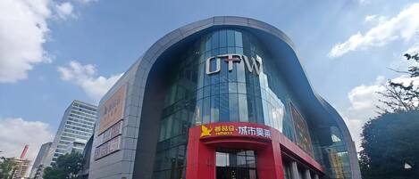 A modern building with a curved facade and large glass windows.